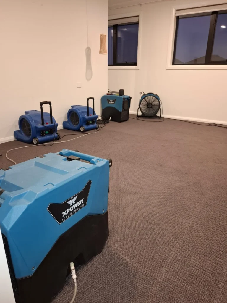Flood restoration in progress in Geelong with professional technicians carrying out water extraction and structural drying