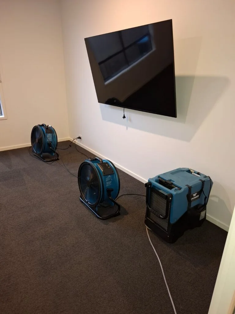 Flood Restoration Geelong team working at residential property with professional drying machines on the floor