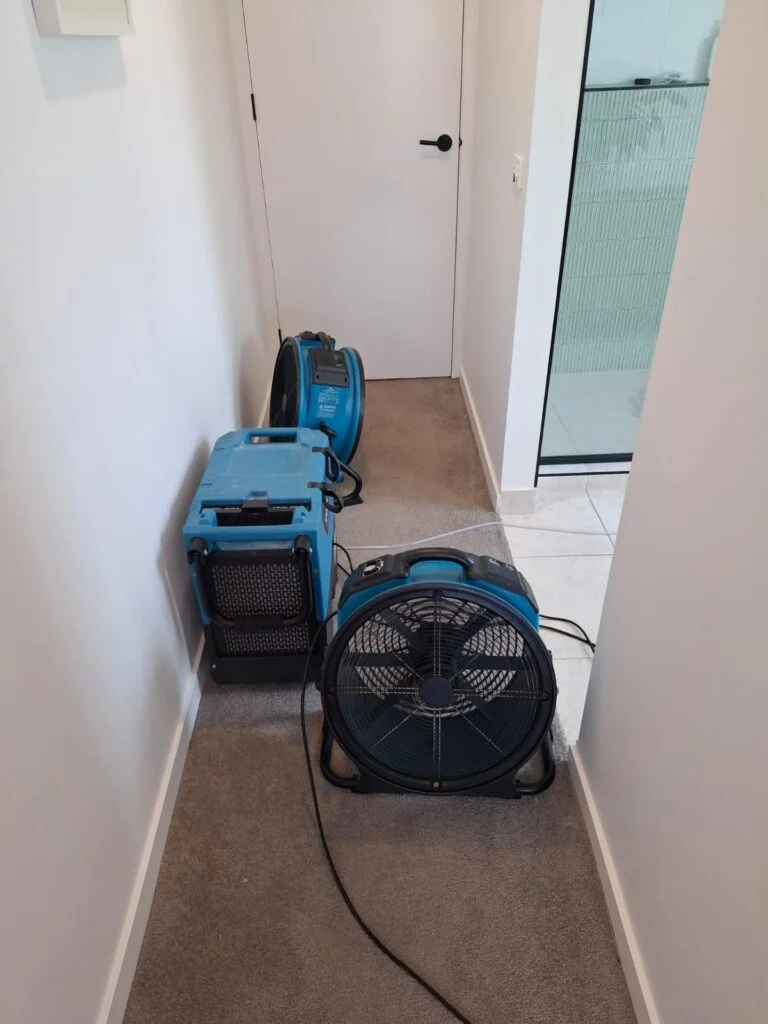 Flood restoration ongoing at a Geelong property with professional water extraction and drying equipment in use
