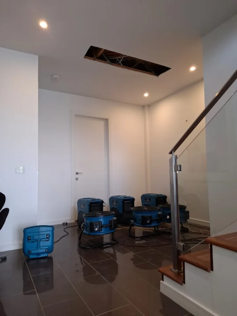 Flood restoration under process in a Geelong property with multiple state-of-the-art drying and dehumidification machines operating indoors